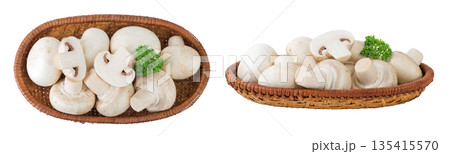Fresh mushroom champignon in a wicker basket isolated on white background. Top view. Flat lay. 135415570