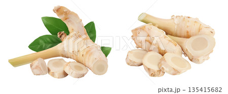 Fresh galangal root with slices isolated on white background with full depth of field. Fresh galangal root with slices isolated on white background with full depth of field. 135415682