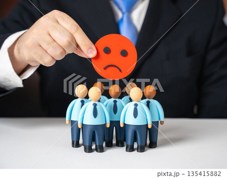 Low morale within the business company. Dissatisfaction among the workforce. Burnout signals, lack of motivation and engagement issues affecting productivity, corporate culture 135415882