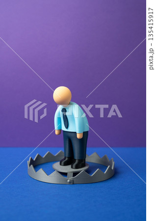 A depressed office worker is like bait in a trap. Stress and burnout. Problems at work. Emotional exhaustion concept, toxic environment, mental health risks and loss of motivation 135415917