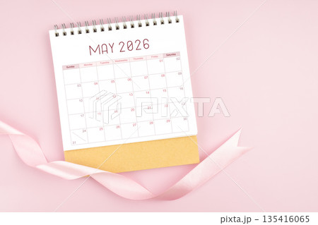May 2026 desk calendar with pink pastel ribbon. May 2026 desk calendar with pink pastel ribbon. 135416065