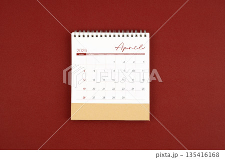 April 2026 desk calendar on red leather. April 2026 desk calendar on red leather. 135416168