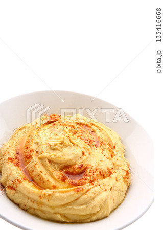 Traditional chickpea hummus with olive oil, spices, and fresh toppings. Traditional chickpea hummus with olive oil, spices, and fresh toppings. 135416668