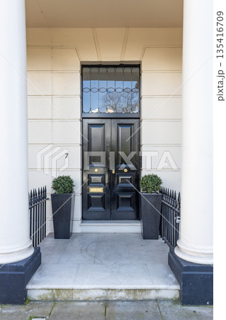 Classic black front door of a luxury London townhouse 135416709