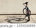 Bicycle isolated on a wall background, with copy space for text 135416890