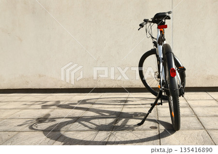Bicycle isolated on a wall background, with copy space for text 135416890