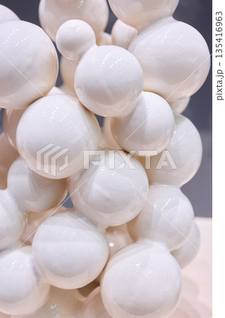 Calm matte globes with gentle shadows and refined arrangement 135416963