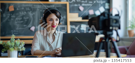 Young woman recording online video lesson at home office 135417553
