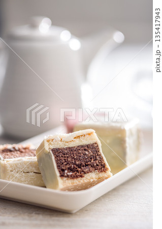 Sweet dessert cake. Mini pie on plate on kitchen table. 135417943