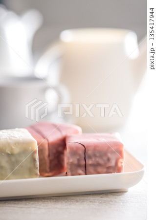 Sweet dessert cake. Mini pie on plate on kitchen table. 135417944