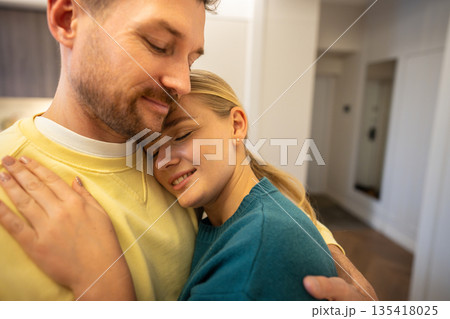 Peaceful couple man and woman partners hugging and showing strong bond an love in relationships. Peaceful couple man and woman partners hugging and showing strong bond an love in relationships. 135418025