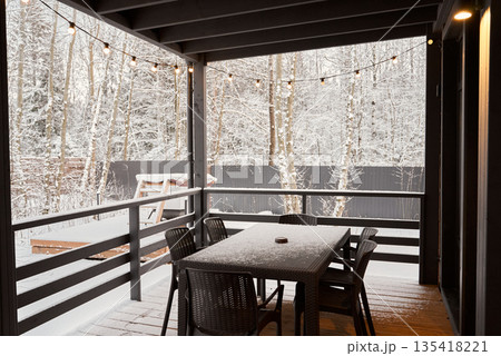 Cozy sunset gathering, Evening patio with warm illumination Cozy sunset gathering, Evening patio with warm illumination 135418221