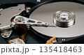 Close up view of the inside of a hard disk drive. HDD data storage mechanism. 135418463