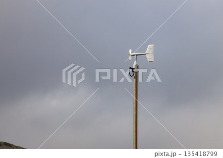 Blade type or Windmill type anemometer on top of the pole, install near crater of volcano. 135418799