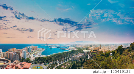 Malaga, Spain. Panorama Cityscape Elevated View Of Malaga In Sunny Summer Evening. Altered Sunset Sky 135419122