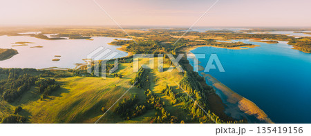 Braslaw Or Braslau, Vitebsk Voblast, Belarus. Aerial View Of Voyso Lake And Nyespish Lake In Sunny Autumn Morning. Top View Of Beautiful European Nature From High Attitude. Bird's Eye View. Panorama Braslaw Or Braslau, Vitebsk Voblast, Belarus. Aerial View Of Voyso Lake And Nyespish Lake In Sunny Autumn Morning. Top View Of Beautiful European Nature From High Attitude. Bird's Eye View. Panorama 135419156