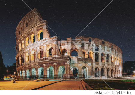 Rome, Italy. Colosseum Also Known As Flavian Amphitheatre In Evening Or Night Time. Rome, Italy. Colosseum Also Known As Flavian Amphitheatre In Evening Or Night Time. 135419165