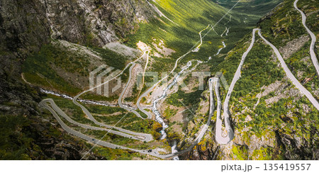 Trollstigen, Andalsnes, Norway. Cars Goes On Serpentine Mountain Road Trollstigen. Famous Norwegian Landmark And Popular Destination. Norwegian County Road 63 In Summer Day. 4K 135419557