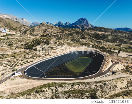 Aerial view of water reservoir surrounded by terraced farmland Aerial view of water reservoir surrounded by terraced farmland 135421088