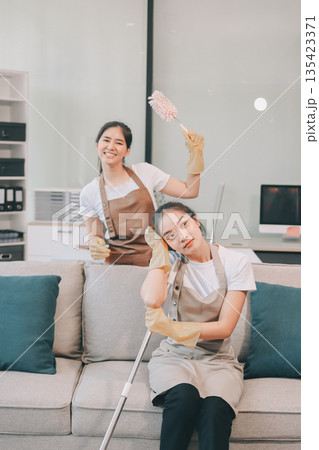 Cleaners clean empty office spaces Cleaners clean empty office spaces 135423371