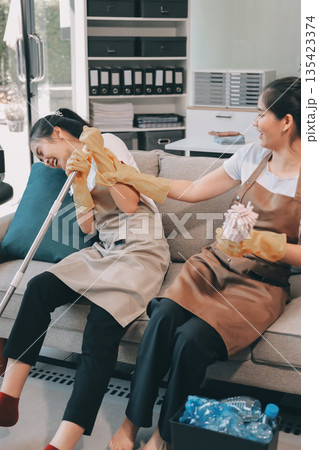 Cleaners clean empty office spaces Cleaners clean empty office spaces 135423374