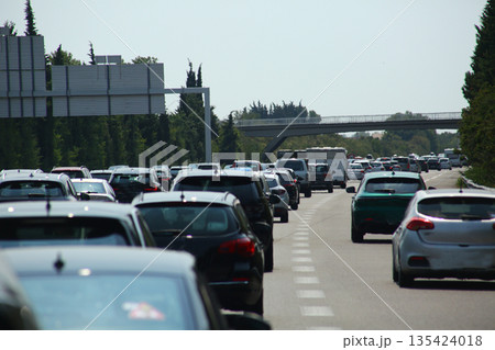 Heavy traffic congestion on highway with cars, tunnels, and traffic signals. Heavy traffic congestion on highway with cars, tunnels, and traffic signals. 135424018