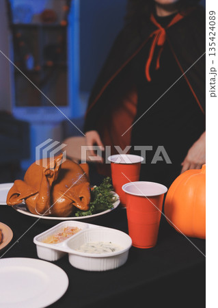 Friends enjoying a Halloween party at a bar making a toast 135424089