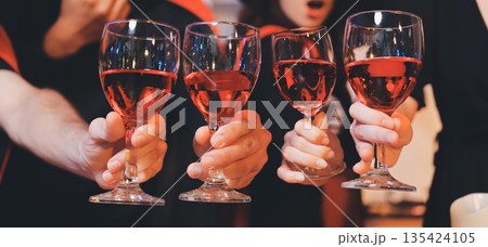 Friends enjoying a Halloween party at a bar making a toast Friends enjoying a Halloween party at a bar making a toast 135424105