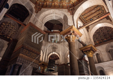 Interior view of the Qalawun Complex on Al-Muizz Street. Features intricate Islamic architecture with ornate ceilings and detailed wooden elements 135424114