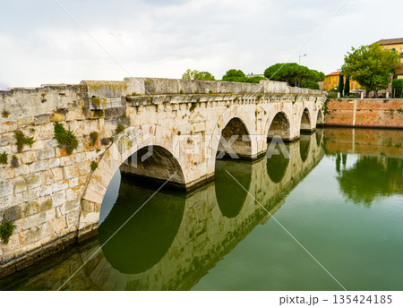 Tiberius Bridge over the river in Rimini. Italian classical architecture. A city landmark. 135424185