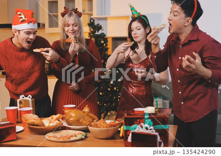 Festive Office Christmas Party with Delicious Food. A beautifully decorated office space with Christmas trees and festive lights, set up for a holiday party. Festive Office Christmas Party with Delicious Food. A beautifully decorated office space with Christmas trees and festive lights, set up for a holiday party. 135424290