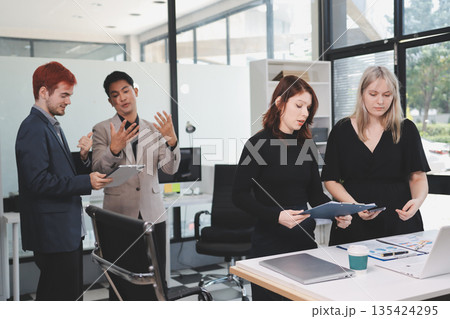 Multiracial business people having meeting Multiracial business people having meeting 135424295