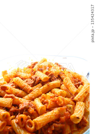 Classic macaroni bolognese with tomato meat sauce and grated cheese topping. 135424317
