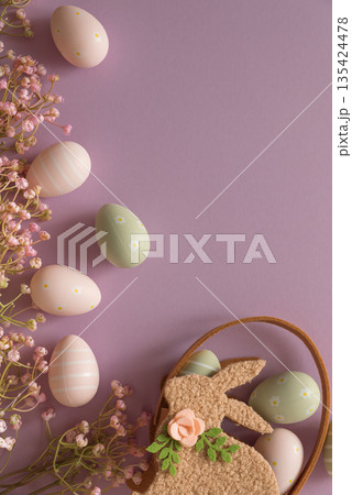 Pastel Easter Bunny Basket with Eggs and Flowers on Lavender Background Pastel Easter Bunny Basket with Eggs and Flowers on Lavender Background 135424478