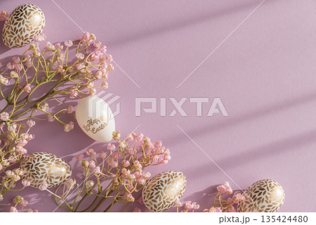 Pastel Easter Eggs with Gold Details and Flowers on Lavender Background Pastel Easter Eggs with Gold Details and Flowers on Lavender Background 135424480