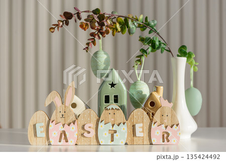 Wooden Easter Letter Eggs with Bunny and Chick Figures. Festive Spring Decor Wooden Easter Letter Eggs with Bunny and Chick Figures. Festive Spring Decor 135424492