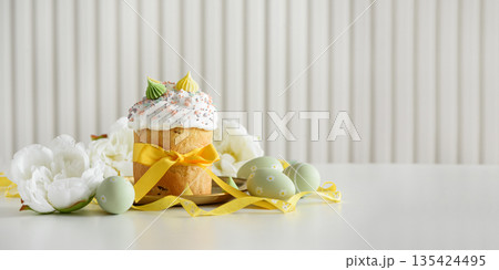 Easter Cake Decorated Yellow Ribbon with Flowers and Pastel Eggs on White Background 135424495