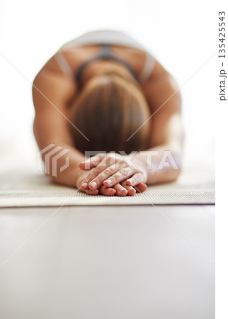 Woman, hands and stretching body in yoga on floor mat for spiritual wellness, exercise or zen workout at home. Female person or yogi in warm up stretch for fitness or mental health on mockup space Woman, hands and stretching body in yoga on floor mat for spiritual wellness, exercise or zen workout at home. Female person or yogi in warm up stretch for fitness or mental health on mockup space 135425543