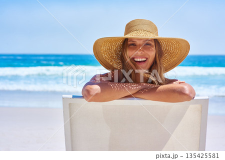Portrait, beach and woman with a smile, holiday and summer getaway with tourism, break or travelling. Face, female person or girl on a chair, seaside vacation or travel with a hat or relax with waves Portrait, beach and woman with a smile, holiday and summer getaway with tourism, break or travelling. Face, female person or girl on a chair, seaside vacation or travel with a hat or relax with waves 135425581