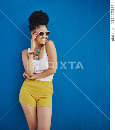 Sunglasses, fashion and portrait of woman on blue background, wall and summer streetwear, trendy clothes or shades mockup. Girl, happy and excited model with cool style, vision and urban mock up 135425585