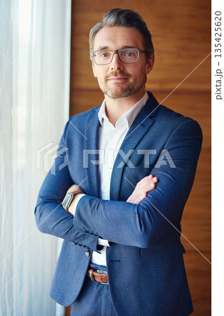 Business, portrait of businessman with arms crossed and standing in his office, Confident or proud, ceo management or mature manager and professional corporate man stand in modern workplace Business, portrait of businessman with arms crossed and standing in his office, Confident or proud, ceo management or mature manager and professional corporate man stand in modern workplace 135425620