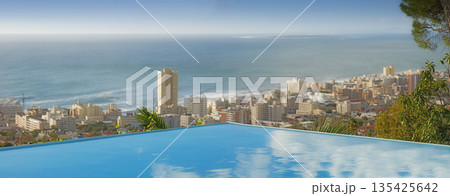 Travel, ocean and infinity pool in city on vacation and hotel view in Cape Town with nobody, buildings and urban beach property. Cityscape, sea and sky at luxury accommodation for summer holiday trip Travel, ocean and infinity pool in city on vacation and hotel view in Cape Town with nobody, buildings and urban beach property. Cityscape, sea and sky at luxury accommodation for summer holiday trip 135425642