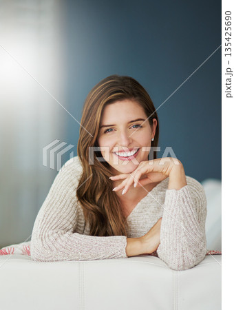 Smile, portrait and woman relax on sofa in home living room on holiday. Face, happy and young female person from Canada on couch in lounge, apartment or house to enjoy mockup space and lens flare. Smile, portrait and woman relax on sofa in home living room on holiday. Face, happy and young female person from Canada on couch in lounge, apartment or house to enjoy mockup space and lens flare. 135425690