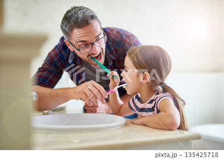 Kid, father and brushing teeth in bathroom, bonding and cleaning together. Dad, girl and toothbrush for dental hygiene, oral wellness or health for happy family care, teaching and learning at home. Kid, father and brushing teeth in bathroom, bonding and cleaning together. Dad, girl and toothbrush for dental hygiene, oral wellness or health for happy family care, teaching and learning at home. 135425718