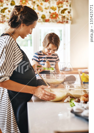 Mother, pregnant or girl baking in kitchen as a happy family with a kid learning cookies or cake recipe at home. Maternity, cooking or mother baker helping or teaching child to bake for development 135425771