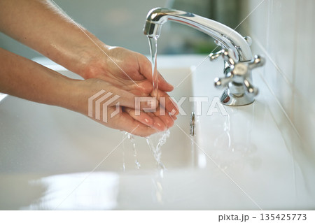 Clean, bathroom and hands with water for wash or dirt, bacteria and safety from germs at home. Woman, cleaning and hand for self care for healthy person for disinfection and hygiene at the house. Clean, bathroom and hands with water for wash or dirt, bacteria and safety from germs at home. Woman, cleaning and hand for self care for healthy person for disinfection and hygiene at the house. 135425773