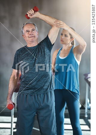 Physiotherapy, dumbbell and fitness with old man and personal trainer for support, health and workout. Training, weightlifting or coaching with senior patient and physiotherapist for elderly exercise Physiotherapy, dumbbell and fitness with old man and personal trainer for support, health and workout. Training, weightlifting or coaching with senior patient and physiotherapist for elderly exercise 135425807