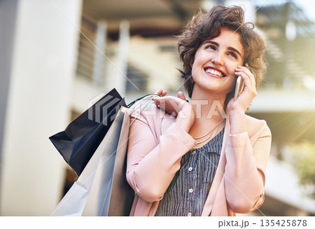 Woman, phone call and city with shopping bags, sale and happiness for discount on walk in summer. Girl, retail deal and fashion with smartphone in metro cbd with communication, promotion and clothes 135425878