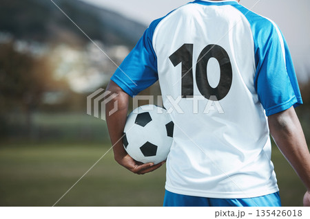 Soccer ball, sports and man with uniform number on a field for exercise, fitness and training outdoor. Football club, pitch and event or game with athlete person and mockup for sport competition 135426018