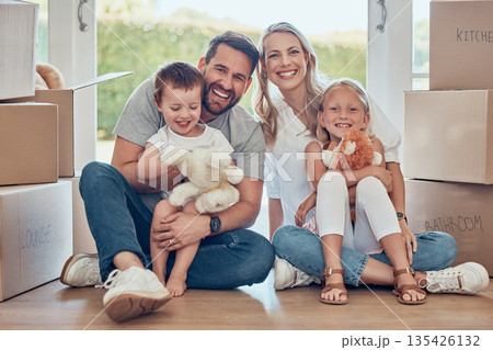 Portrait, happy family and kids on floor of new home, real estate and property loan for relocation. Children, parents and moving in together for building investment, mortgage and boxes in apartment Portrait, happy family and kids on floor of new home, real estate and property loan for relocation. Children, parents and moving in together for building investment, mortgage and boxes in apartment 135426132